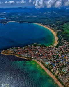 Aerial view of Primorsko, Bulgaria, venue of the Erasmus+ Partnership Building Activity — the town on a peninsula between two Black Sea beaches